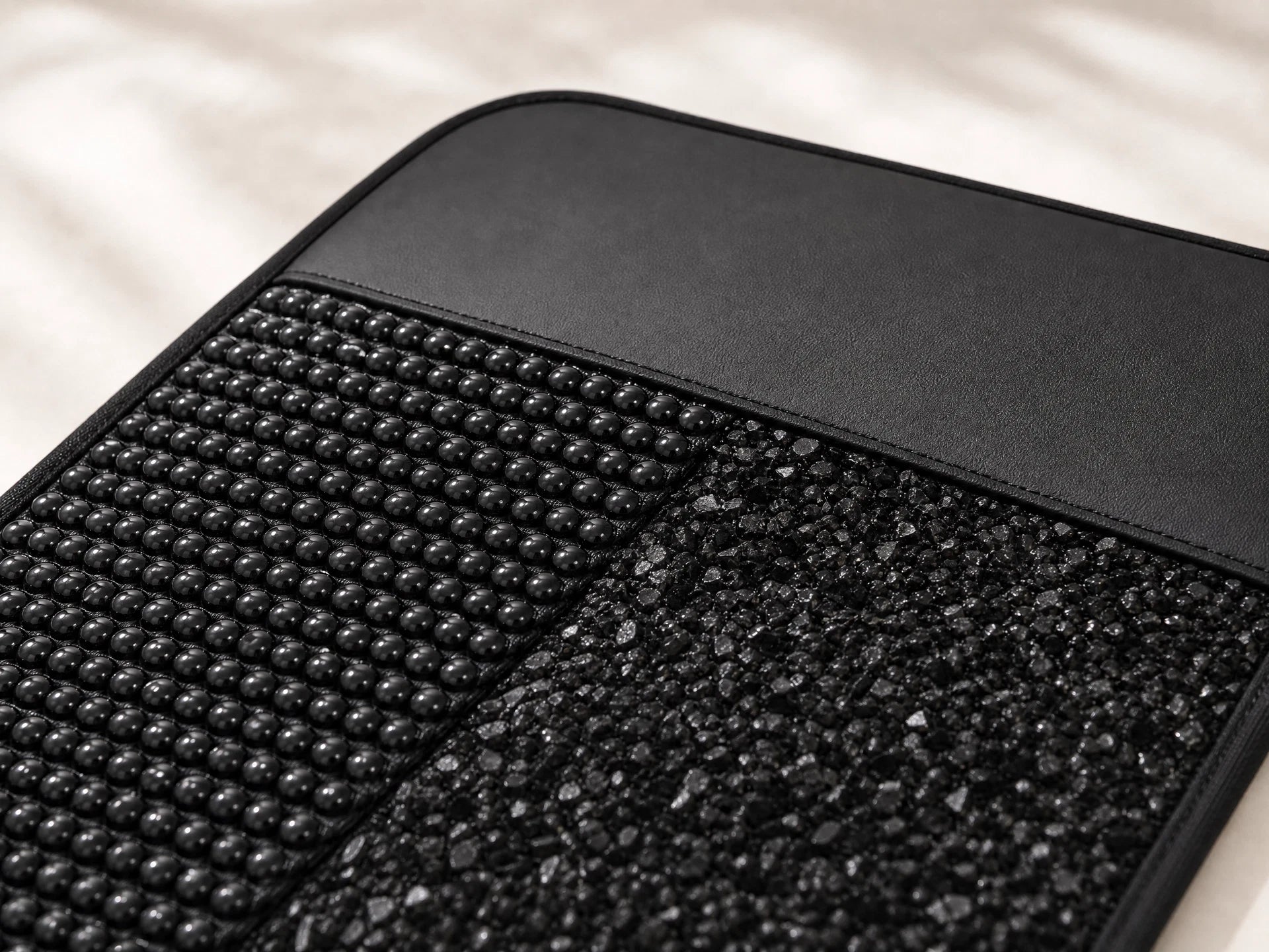Close view of the black mineral-bead and black tourmaline surface with precise MB Aura edge construction
